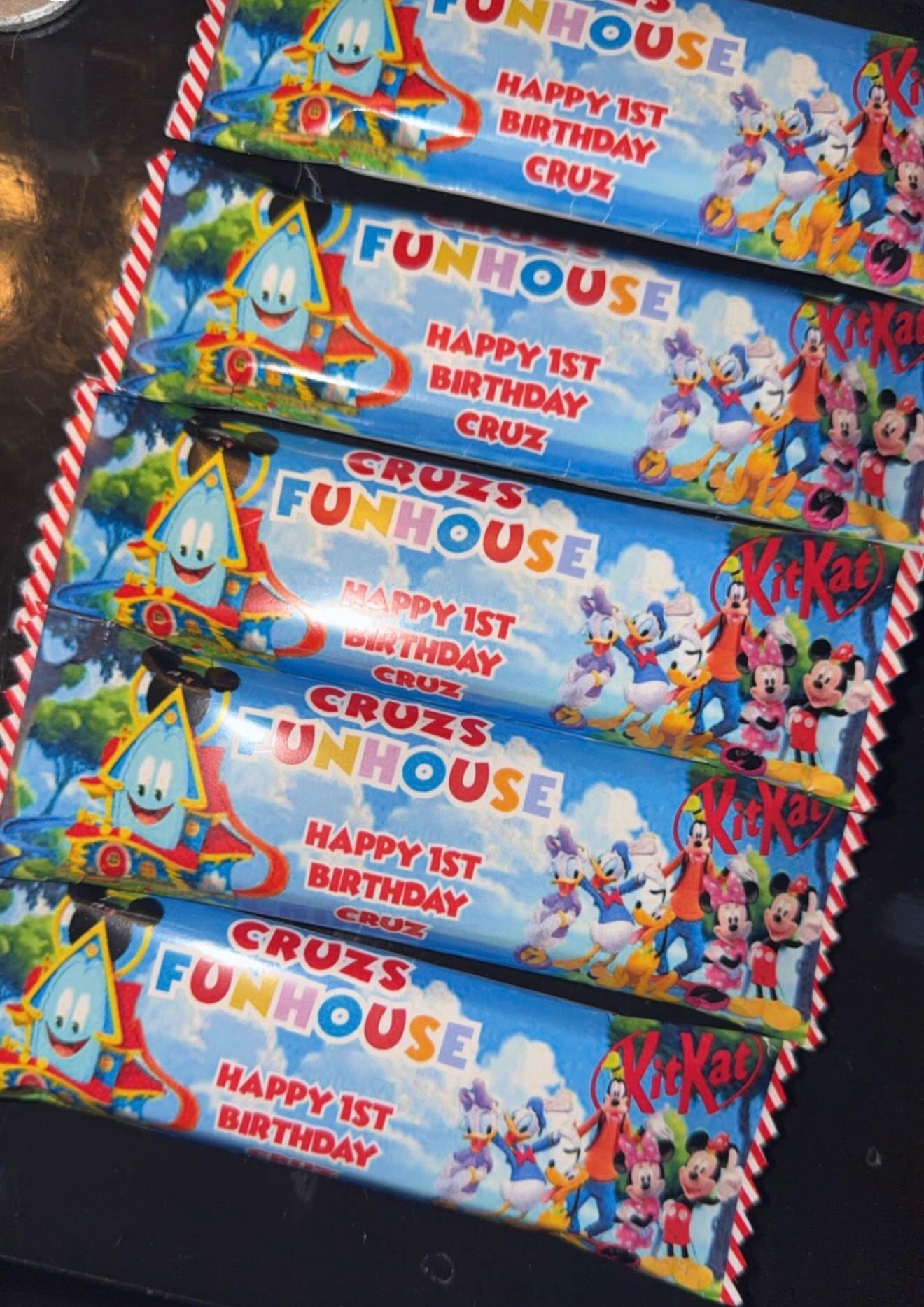Personalised chocolate bars arranged together for a first birthday party